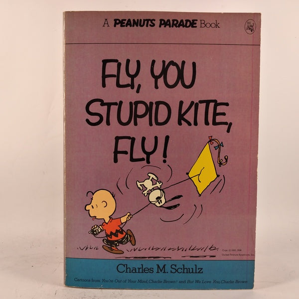 Fly, you stupid kite, fly! af Charles M. Schulz